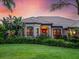 Inviting home with a manicured lawn and beautiful greenery at 312 148Th Ne Ct, Bradenton, FL 34212