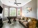 Cozy game room with a sofa, foosball table, and plantation shutters at 312 148Th Ne Ct, Bradenton, FL 34212