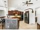 Well-equipped kitchen showcasing dark wood cabinets, stainless steel appliances, and a granite island with bar seating at 312 148Th Ne Ct, Bradenton, FL 34212