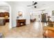Bright living area featuring tile floors, fireplace, and an open floor plan leading to the kitchen and dining room at 312 148Th Ne Ct, Bradenton, FL 34212