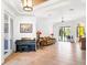 Open living space with tile flooring, a piano, and sliding glass doors to the lanai at 312 148Th Ne Ct, Bradenton, FL 34212
