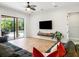 Comfortable living room with a large sliding glass door leading to the pool and lanai at 312 148Th Ne Ct, Bradenton, FL 34212