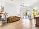 Spacious living room featuring neutral walls, tile flooring, and sliding doors leading to the outdoor space at 312 148Th Ne Ct, Bradenton, FL 34212
