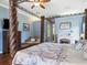 Bright and airy main bedroom with a view, fireplace, and hardwood floors at 312 148Th Ne Ct, Bradenton, FL 34212
