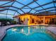 Lovely outdoor pool and spa under a covered lanai for relaxation at 312 148Th Ne Ct, Bradenton, FL 34212