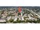 Aerial view of the residential neighborhood featuring lush landscaping and red-tiled rooftops at 3253 Beneva Rd # 103, Sarasota, FL 34232