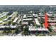 Aerial view of condo complex with mature trees and well-maintained landscaping at 3253 Beneva Rd # 103, Sarasota, FL 34232