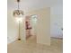 Open dining room shows view of the kitchen and has light fixture and tile floors at 3253 Beneva Rd # 103, Sarasota, FL 34232