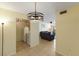 View from the dining room into the kitchen and the living room beyond at 3253 Beneva Rd # 103, Sarasota, FL 34232