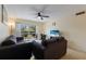 Comfortable living room features neutral walls, tile floors, and sliding doors to outdoor patio at 3253 Beneva Rd # 103, Sarasota, FL 34232