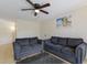 Comfortable living room with tile floors, two sofas, and overhead ceiling fan at 3253 Beneva Rd # 103, Sarasota, FL 34232
