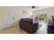 Cozy living room with tile floors, neutral walls, and sliding glass doors to the patio at 3253 Beneva Rd # 103, Sarasota, FL 34232