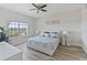Comfortable bedroom with light wood floors, stylish decor, and a bright window at 3702 54Th W Dr # 102, Bradenton, FL 34210