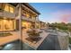 Elegant backyard with swimming pool, sun loungers, a spa, and an outdoor kitchen at 3799 Flamingo Ave, Sarasota, FL 34242