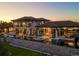 A luxurious backyard features a swimming pool, an outdoor kitchen, and comfortable lounge areas at 3799 Flamingo Ave, Sarasota, FL 34242