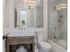 Classic bathroom featuring a combination shower and tub, complemented by a white-painted vanity at 3799 Flamingo Ave, Sarasota, FL 34242