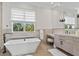 Bathroom with modern fixtures, sleek vanity, and a spacious walk-in shower at 3799 Flamingo Ave, Sarasota, FL 34242