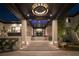 Elegant front entrance features stone accents, steps leading to the dark wood ceiling with a chandelier at 3799 Flamingo Ave, Sarasota, FL 34242