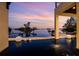 Enjoy this infinity pool at sunset with a waterfront view of the gorgeous bay at 3799 Flamingo Ave, Sarasota, FL 34242