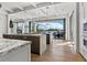 Gourmet kitchen boasts marble countertops, stainless appliances, pendant lighting, and waterfront access at 3799 Flamingo Ave, Sarasota, FL 34242