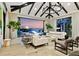 Bright living room with floor-to-ceiling windows and water views at dusk at 3799 Flamingo Ave, Sarasota, FL 34242