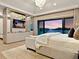 Main bedroom with scenic water views, stylish decor, and modern media center at 3799 Flamingo Ave, Sarasota, FL 34242
