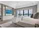 Bright main bedroom with water views and luxurious finishes throughout, including a stylish media center at 3799 Flamingo Ave, Sarasota, FL 34242