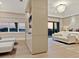 Spacious main bedroom with water view, stylish decor and media center at 3799 Flamingo Ave, Sarasota, FL 34242