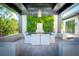 Outdoor dining area with lush green wall, seating area and views of the backyard at 3799 Flamingo Ave, Sarasota, FL 34242