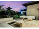 Outdoor patio with ample seating and views of palm trees and vibrant pink sunset at 3799 Flamingo Ave, Sarasota, FL 34242