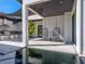 Outdoor space with modern outdoor kitchen, stylish hanging chairs, and reflective water feature at 3799 Flamingo Ave, Sarasota, FL 34242