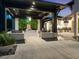 Covered patio with outdoor kitchen, living wall feature, and comfortable seating at 3799 Flamingo Ave, Sarasota, FL 34242