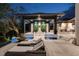 Outdoor living area with resort-style pool, covered patio, and stylish lounge furniture at 3799 Flamingo Ave, Sarasota, FL 34242
