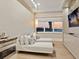 Bedroom sitting area with water views, stylish decor, and media center at 3799 Flamingo Ave, Sarasota, FL 34242