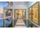 Striking water feature with stepping stones leading to a light-filled living space and waterfront views at 3799 Flamingo Ave, Sarasota, FL 34242