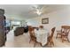 Inviting dining room features a decorative table and comfortable living room seating nearby at 3801 Lake Bayshore Dr # H413, Bradenton, FL 34205