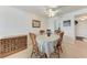 The dining room showcases a table with chairs and a wooden cabinet against a white wall at 3801 Lake Bayshore Dr # H413, Bradenton, FL 34205