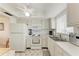 Bright kitchen features white cabinets, appliances and tile flooring for easy upkeep at 3801 Lake Bayshore Dr # H413, Bradenton, FL 34205