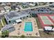 Aerial view of community pool, tennis courts, and clubhouse with ample parking at 4116 43Rd W Ave, Bradenton, FL 34205