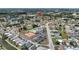 Aerial view showing community pool, tennis courts, and surrounding neighborhood at 4116 43Rd W Ave, Bradenton, FL 34205