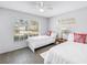 Inviting bedroom with two twin beds, bright white bedding, and large windows offering plenty of natural light at 4116 43Rd W Ave, Bradenton, FL 34205
