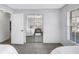Bedroom with twin beds reflected in mirrored closet doors, providing a glimpse of the room's layout and style at 4116 43Rd W Ave, Bradenton, FL 34205
