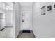 Bright entrance hallway featuring tile flooring and ample natural light from a nearby window at 4116 43Rd W Ave, Bradenton, FL 34205