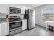 Updated kitchen with stainless steel appliances, granite countertops, and bright natural lighting at 4116 43Rd W Ave, Bradenton, FL 34205