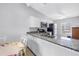 Bright kitchen with granite countertops, stainless appliances, and a cozy breakfast table at 4116 43Rd W Ave, Bradenton, FL 34205