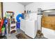 Functional laundry area with white washer and dryer for convenient chores at 4116 43Rd W Ave, Bradenton, FL 34205