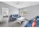 Bright living room boasts an open layout, comfortable seating, and large windows at 4116 43Rd W Ave, Bradenton, FL 34205