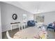 Open-concept living area featuring sleek floors, modern furniture, and ample natural light at 4116 43Rd W Ave, Bradenton, FL 34205
