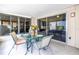 Outdoor patio with glass table set, perfect for enjoying a meal or relaxing in the fresh air near sliding glass doors at 4116 43Rd W Ave, Bradenton, FL 34205