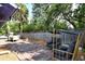 Well-manicured backyard featuring a brick patio with seating and a lounge area at 4137 Woodview Dr, Sarasota, FL 34232